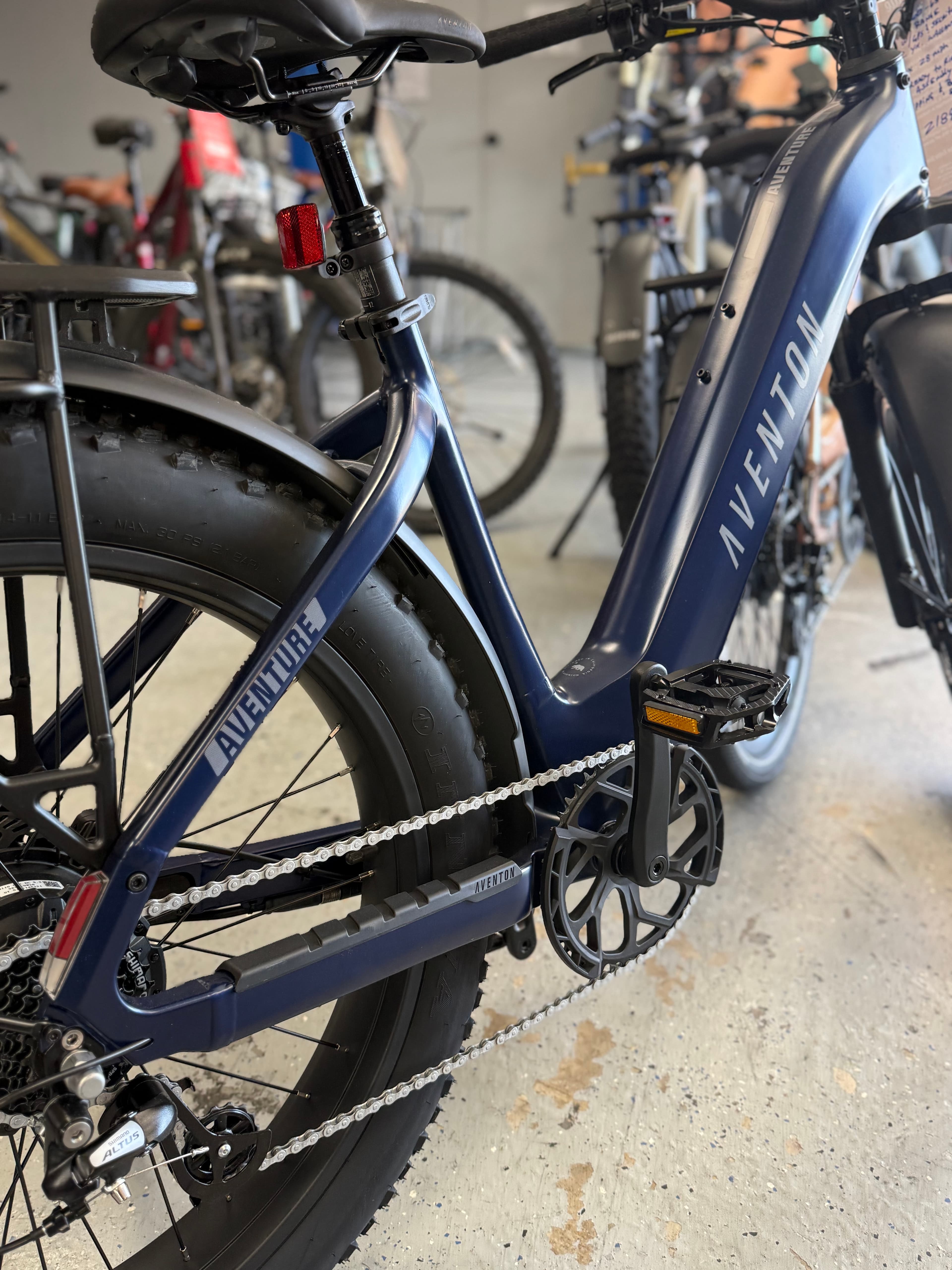 Aventon e-bikes on the floor at Just Ride