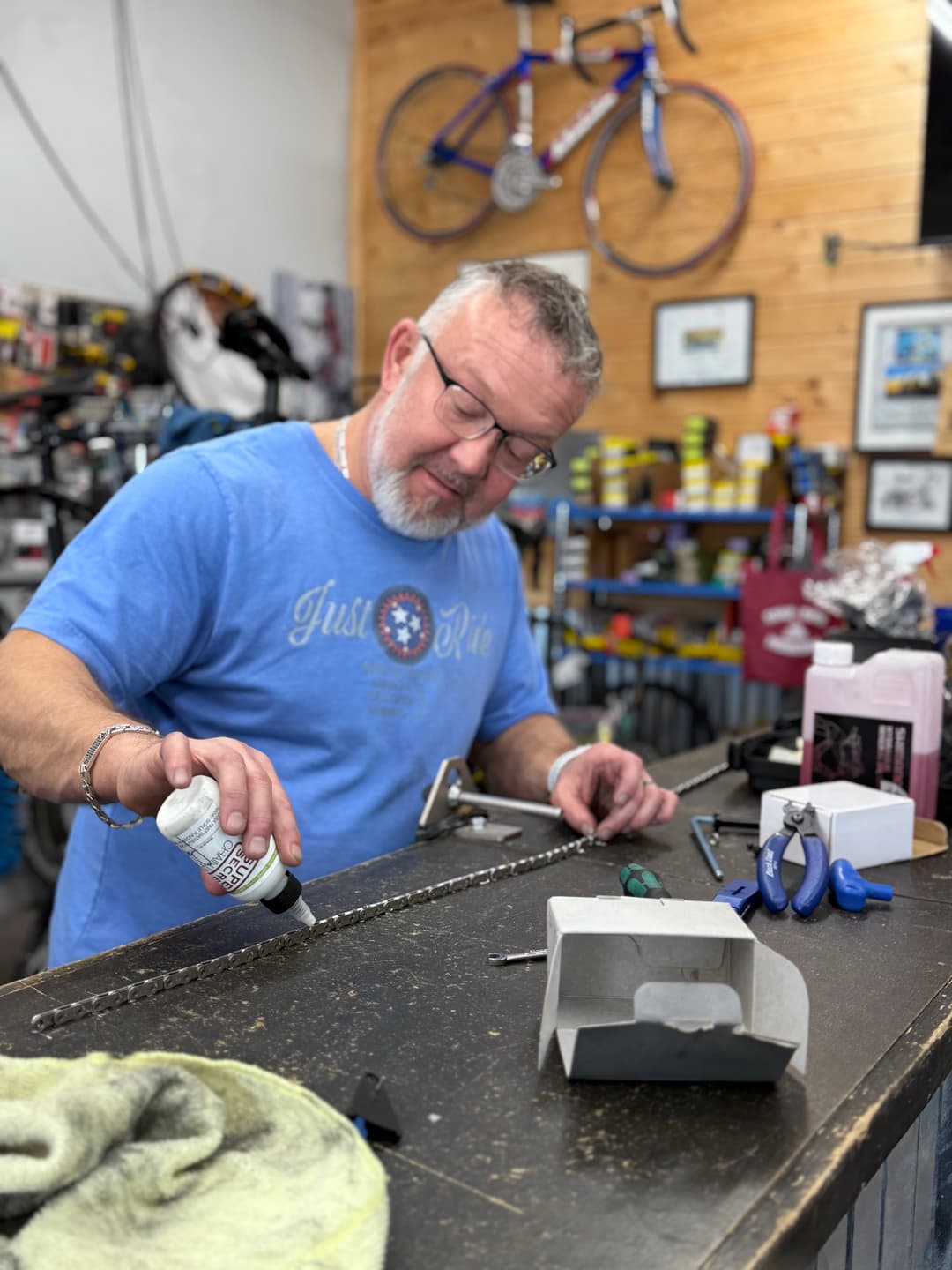 Brian fine-tuning a bike at the workbench