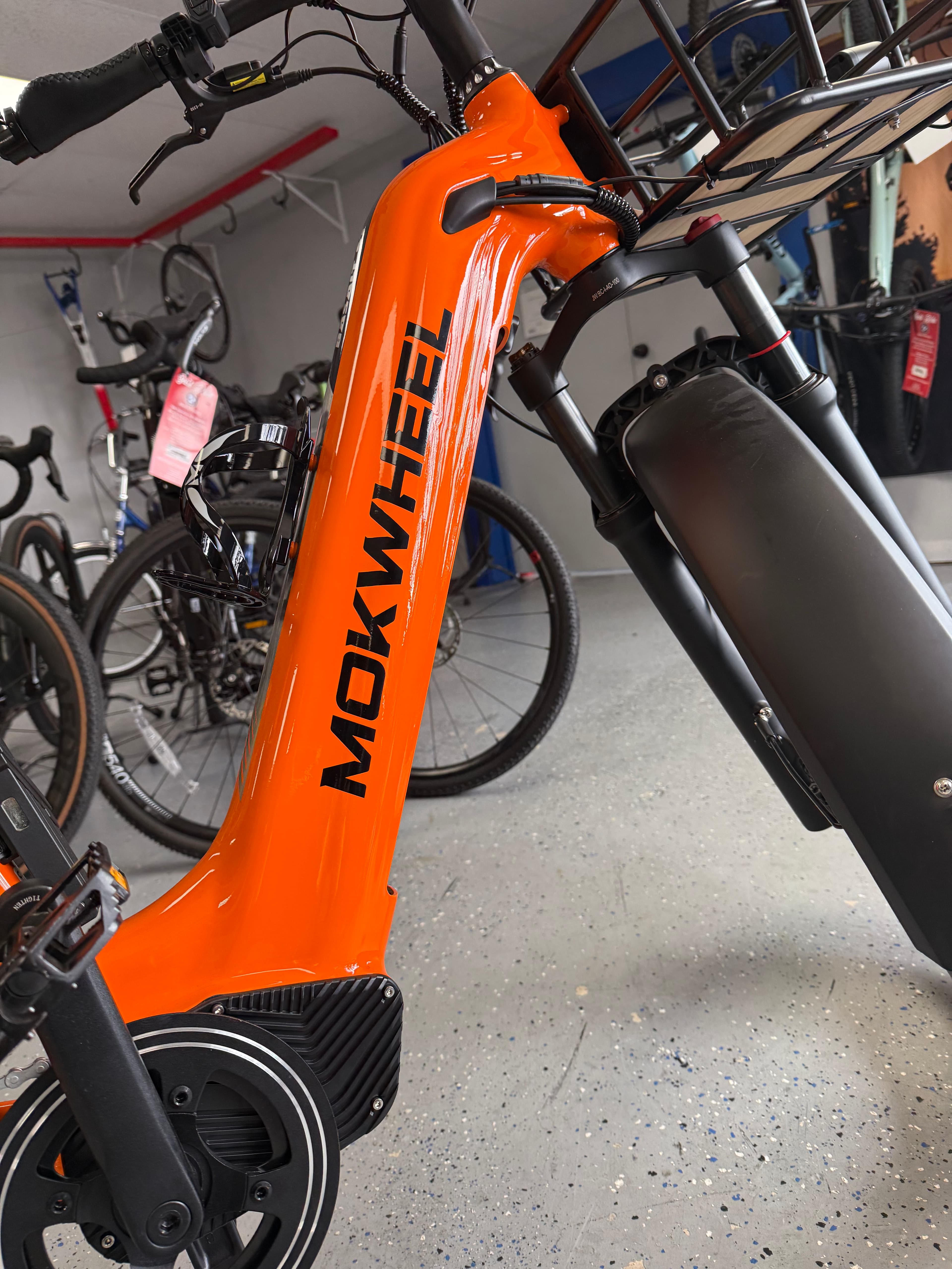 Mokwheel e-bikes on the floor at Just Ride